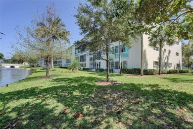 Enjoy resort-style living in Wynmoor's sought-after Antigua I on Wynmoor Golf Course in Florida - for sale on GolfHomes.com, golf home, golf lot