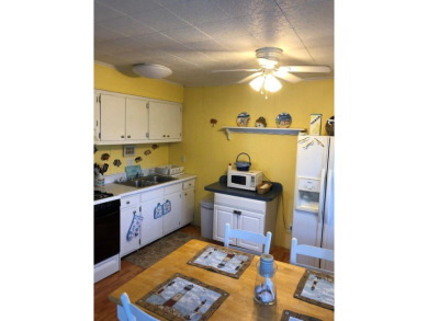 Cozy cottage with open floor plan and beachy feel.  Fully on Captains Cove Golf and Yacht Club in Virginia - for sale on GolfHomes.com, golf home, golf lot