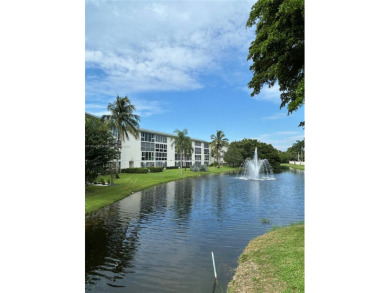 Enjoy resort-style living in Wynmoor's sought-after Antigua I on Wynmoor Golf Course in Florida - for sale on GolfHomes.com, golf home, golf lot