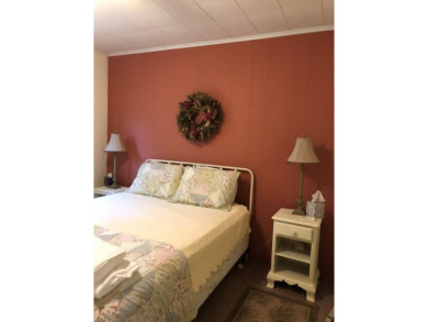 Cozy cottage with open floor plan and beachy feel.  Fully on Captains Cove Golf and Yacht Club in Virginia - for sale on GolfHomes.com, golf home, golf lot