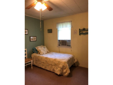 Cozy cottage with open floor plan and beachy feel.  Fully on Captains Cove Golf and Yacht Club in Virginia - for sale on GolfHomes.com, golf home, golf lot