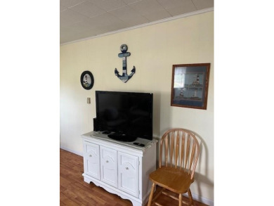 Cozy cottage with open floor plan and beachy feel.  Fully on Captains Cove Golf and Yacht Club in Virginia - for sale on GolfHomes.com, golf home, golf lot