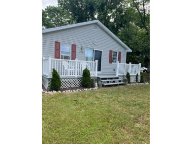 Cozy cottage with open floor plan and beachy feel.  Fully on Captains Cove Golf and Yacht Club in Virginia - for sale on GolfHomes.com, golf home, golf lot