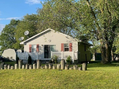 Cozy cottage with open floor plan and beachy feel.  Fully on Captains Cove Golf and Yacht Club in Virginia - for sale on GolfHomes.com, golf home, golf lot