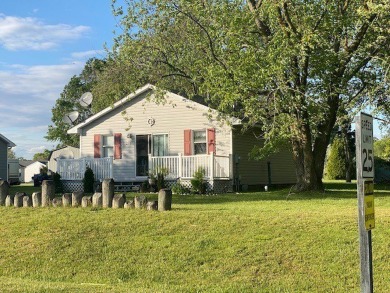 Cozy cottage with open floor plan and beachy feel.  Fully on Captains Cove Golf and Yacht Club in Virginia - for sale on GolfHomes.com, golf home, golf lot