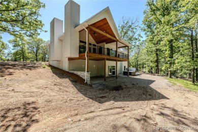 tep into the epitome of luxurious living at The Estates of on The Club At Old Kinderhook in Missouri - for sale on GolfHomes.com, golf home, golf lot