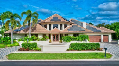 Situated on a double lot of almost 1/2 acre, this architectural on Boca Grove Golf and Tennis in Florida - for sale on GolfHomes.com, golf home, golf lot