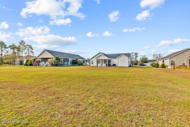 Welcome to this almost-new, stunning single-story home nestled on Bear Trail Golf Club in North Carolina - for sale on GolfHomes.com, golf home, golf lot