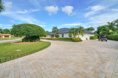 Nestled on an incredible 21,000 sq. ft. lot overlooking the on Atlantis Golf Club in Florida - for sale on GolfHomes.com, golf home, golf lot