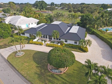 Nestled on an incredible 21,000 sq. ft. lot overlooking the on Atlantis Golf Club in Florida - for sale on GolfHomes.com, golf home, golf lot