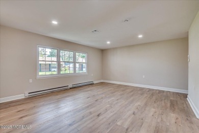 Beautiful end unit features custom eat in kitchen with quartz on Leisure Village East in New Jersey - for sale on GolfHomes.com, golf home, golf lot