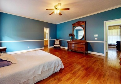Imagine mornings on your spacious covered front porch or on Okefenokee Country Club in Georgia - for sale on GolfHomes.com, golf home, golf lot