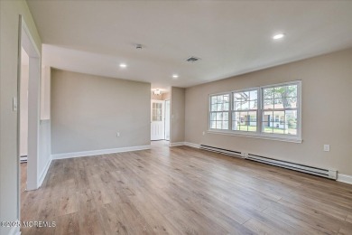 Beautiful end unit features custom eat in kitchen with quartz on Leisure Village East in New Jersey - for sale on GolfHomes.com, golf home, golf lot