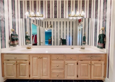 Imagine mornings on your spacious covered front porch or on Okefenokee Country Club in Georgia - for sale on GolfHomes.com, golf home, golf lot