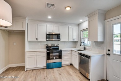 Beautiful end unit features custom eat in kitchen with quartz on Leisure Village East in New Jersey - for sale on GolfHomes.com, golf home, golf lot