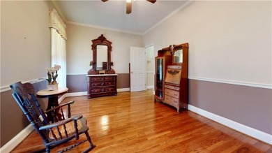 Imagine mornings on your spacious covered front porch or on Okefenokee Country Club in Georgia - for sale on GolfHomes.com, golf home, golf lot
