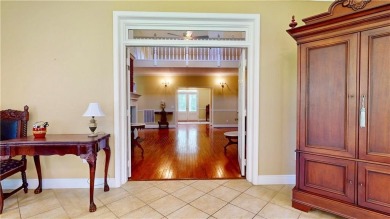 Imagine mornings on your spacious covered front porch or on Okefenokee Country Club in Georgia - for sale on GolfHomes.com, golf home, golf lot