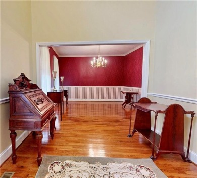 Imagine mornings on your spacious covered front porch or on Okefenokee Country Club in Georgia - for sale on GolfHomes.com, golf home, golf lot
