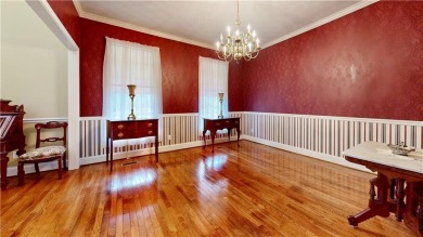 Imagine mornings on your spacious covered front porch or on Okefenokee Country Club in Georgia - for sale on GolfHomes.com, golf home, golf lot