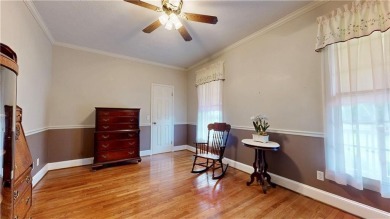 Imagine mornings on your spacious covered front porch or on Okefenokee Country Club in Georgia - for sale on GolfHomes.com, golf home, golf lot