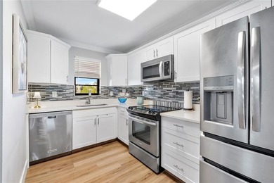 You'll fall in love with this move-in ready & beautifully on Hillsboro Pines Golf in Florida - for sale on GolfHomes.com, golf home, golf lot