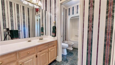 Imagine mornings on your spacious covered front porch or on Okefenokee Country Club in Georgia - for sale on GolfHomes.com, golf home, golf lot
