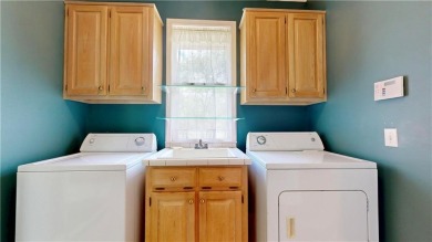 Imagine mornings on your spacious covered front porch or on Okefenokee Country Club in Georgia - for sale on GolfHomes.com, golf home, golf lot