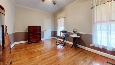Imagine mornings on your spacious covered front porch or on Okefenokee Country Club in Georgia - for sale on GolfHomes.com, golf home, golf lot