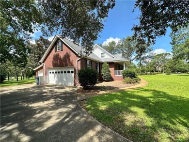 Imagine mornings on your spacious covered front porch or on Okefenokee Country Club in Georgia - for sale on GolfHomes.com, golf home, golf lot