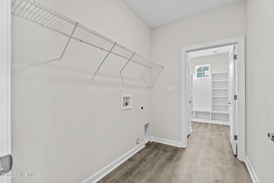 Welcome to the Boardwalk, a stylish, one-level home with modern on Sound Golf Links at Albemarle Plantation in North Carolina - for sale on GolfHomes.com, golf home, golf lot