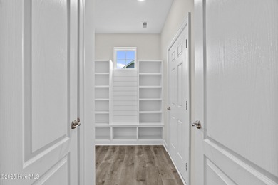 Welcome to the Boardwalk, a stylish, one-level home with modern on Sound Golf Links at Albemarle Plantation in North Carolina - for sale on GolfHomes.com, golf home, golf lot