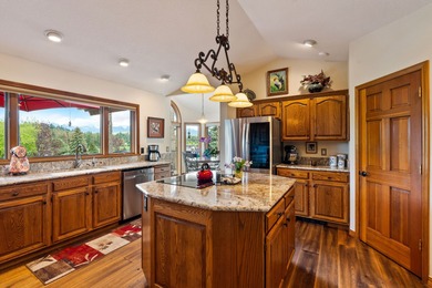 If you want beautiful Swan Mountain views from almost every room on  in Montana - for sale on GolfHomes.com, golf home, golf lot