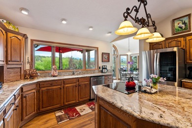 If you want beautiful Swan Mountain views from almost every room on  in Montana - for sale on GolfHomes.com, golf home, golf lot