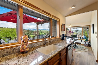 If you want beautiful Swan Mountain views from almost every room on  in Montana - for sale on GolfHomes.com, golf home, golf lot