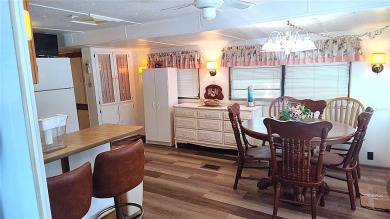 Best value in this park! This vibrant 55+ community provides on River Run Golf Links in Florida - for sale on GolfHomes.com, golf home, golf lot