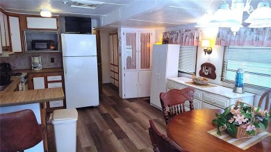 Best value in this park! This vibrant 55+ community provides on River Run Golf Links in Florida - for sale on GolfHomes.com, golf home, golf lot