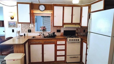 Best value in this park! This vibrant 55+ community provides on River Run Golf Links in Florida - for sale on GolfHomes.com, golf home, golf lot
