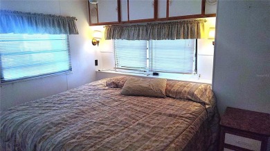 Best value in this park! This vibrant 55+ community provides on River Run Golf Links in Florida - for sale on GolfHomes.com, golf home, golf lot