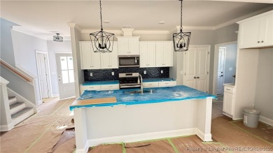 Autry Lake at Gates Four Gated Community, 4 bedroom 2.5 bath on Gates Four Golf and Country Club in North Carolina - for sale on GolfHomes.com, golf home, golf lot
