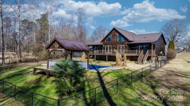 Tucked away in Maiden, this charming log cabin home sits on 1.41 on Glen Oaks Golf and Country Club in North Carolina - for sale on GolfHomes.com, golf home, golf lot