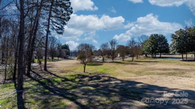 Tucked away in Maiden, this charming log cabin home sits on 1.41 on Glen Oaks Golf and Country Club in North Carolina - for sale on GolfHomes.com, golf home, golf lot