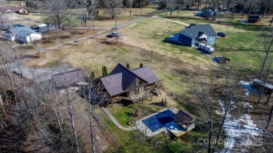 Tucked away in Maiden, this charming log cabin home sits on 1.41 on Glen Oaks Golf and Country Club in North Carolina - for sale on GolfHomes.com, golf home, golf lot