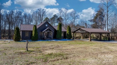 Tucked away in Maiden, this charming log cabin home sits on 1.41 on Glen Oaks Golf and Country Club in North Carolina - for sale on GolfHomes.com, golf home, golf lot