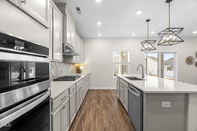 Step into turnkey perfection in the coveted 12 Oaks community on The Club At Twelve Oaks in North Carolina - for sale on GolfHomes.com, golf home, golf lot