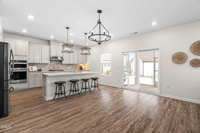 Step into turnkey perfection in the coveted 12 Oaks community on The Club At Twelve Oaks in North Carolina - for sale on GolfHomes.com, golf home, golf lot