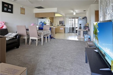 This income-producing duplex is located in San Carlos Park close on Estero Country Club in Florida - for sale on GolfHomes.com, golf home, golf lot