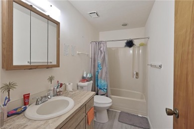 This income-producing duplex is located in San Carlos Park close on Estero Country Club in Florida - for sale on GolfHomes.com, golf home, golf lot