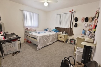 This income-producing duplex is located in San Carlos Park close on Estero Country Club in Florida - for sale on GolfHomes.com, golf home, golf lot