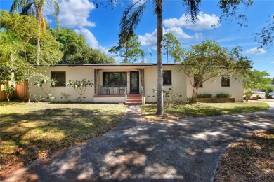 PRICE REDUCED!! ATTENTION: This Lake Hollingsworth mid-century on Cleveland Heights Golf Course in Florida - for sale on GolfHomes.com, golf home, golf lot