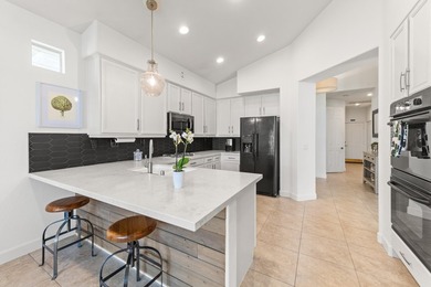 Step into this upgraded Islands 3 model that has been remodeled on Oasis Country Club in California - for sale on GolfHomes.com, golf home, golf lot